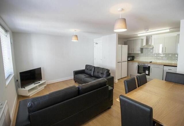 A modern and inviting living room featuring com...