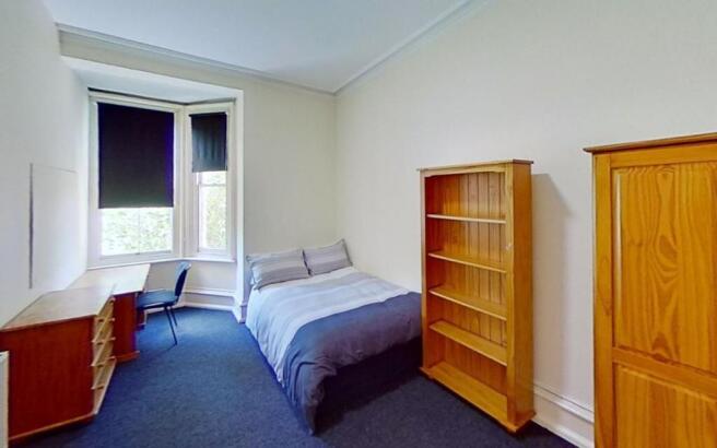Bright and inviting double bedroom featuring a ...