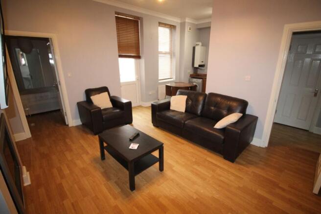A spacious and inviting living room featuring c...