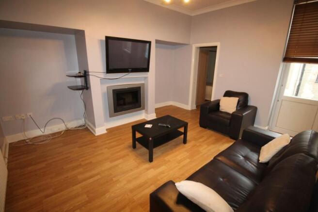 Spacious living room featuring modern furnishin...