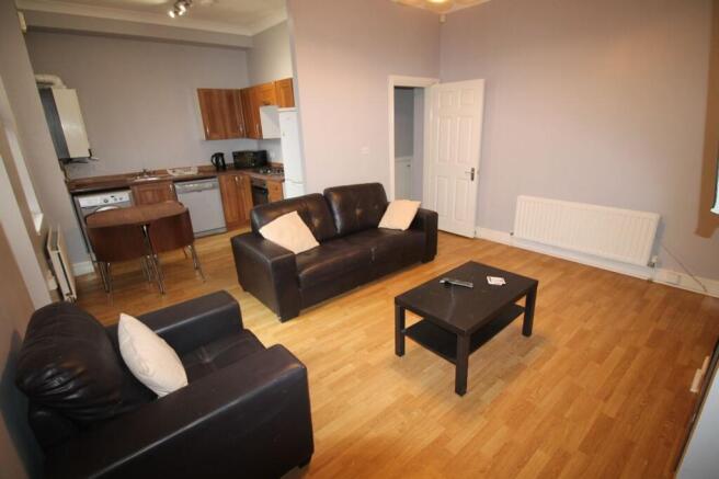 Spacious and inviting living room featuring mod...