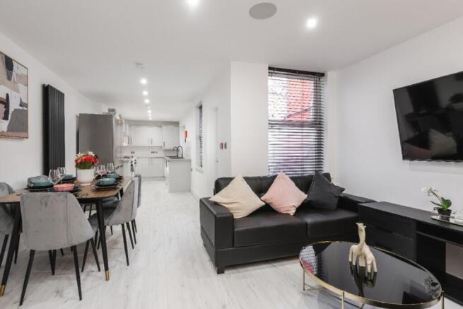 Modern and stylish living room featuring a spac...