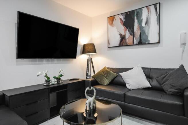 A stylish living room featuring a contemporary ...
