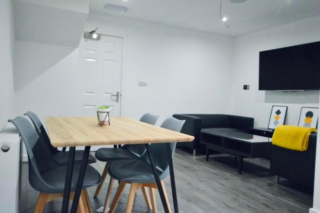 A spacious and inviting modern living room perf...