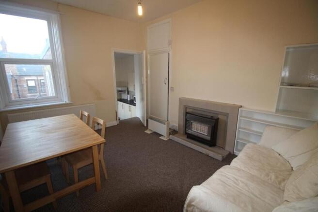 Bright and inviting living room featuring a coz...