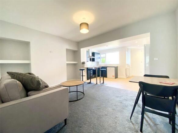 A bright and inviting living room featuring mod...