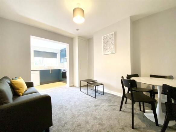 This inviting living room features a cozy seati...