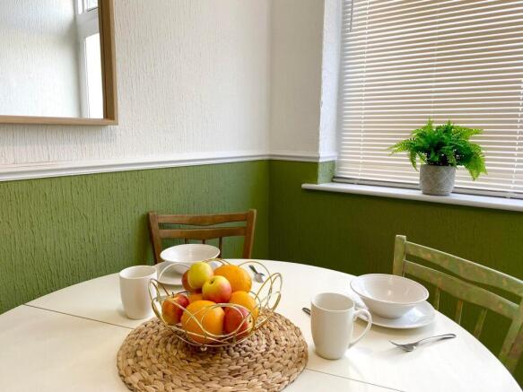 A bright and inviting kitchenette with modern d...
