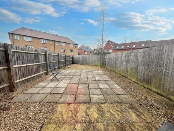 A spacious garden area featuring a well-maintai...