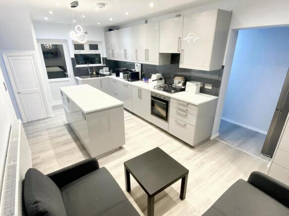Modern kitchen featuring sleek cabinetry and am...
