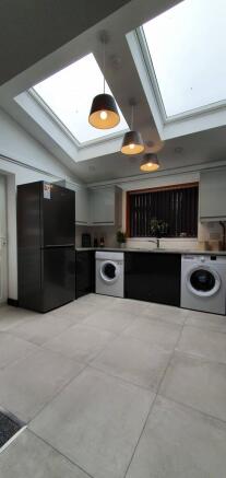 Modern kitchen featuring sleek appliances and a...