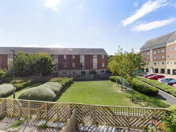 A bright and spacious communal garden area with...