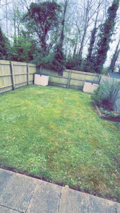 A charming garden space featuring well-maintain...
