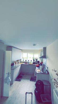 This spacious kitchen offers ample room for coo...