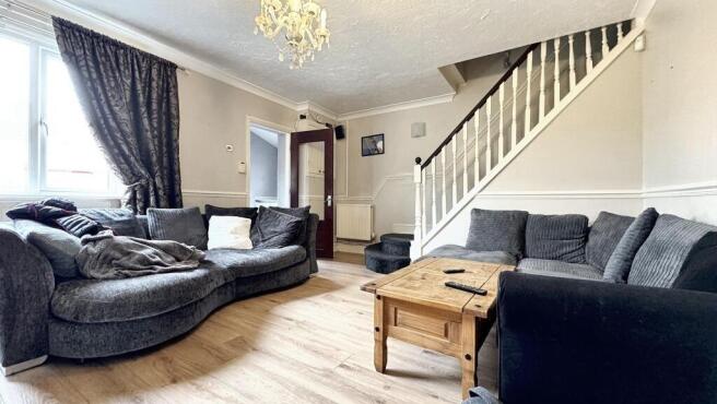 A cozy living room featuring a spacious section...