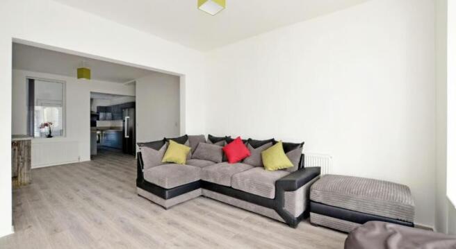 This inviting living room features a cozy secti...