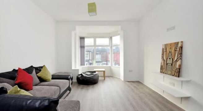 This inviting living room features ample natura...
