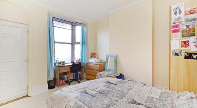 This inviting double bedroom features abundant ...