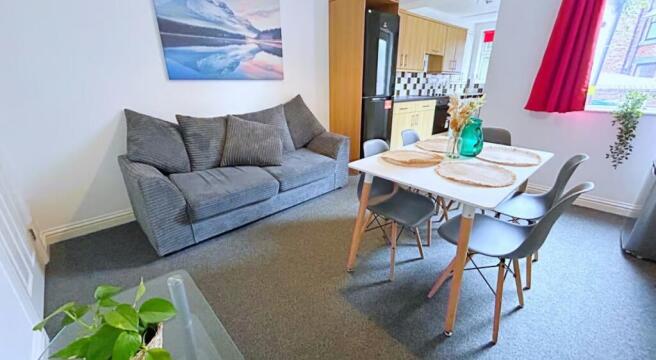 A cozy and inviting living room featuring a com...