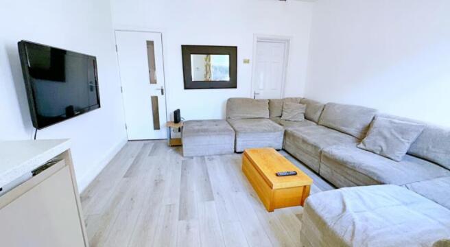 A cozy and inviting living room featuring a spa...