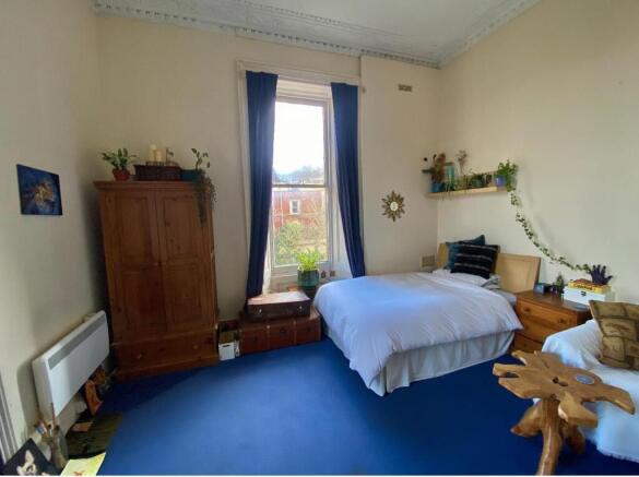 Bright and inviting double bedroom featuring a ...