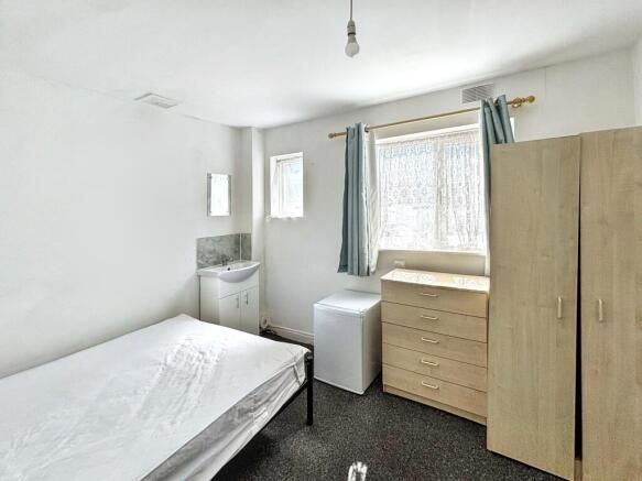Charming double bedroom featuring ample storage...