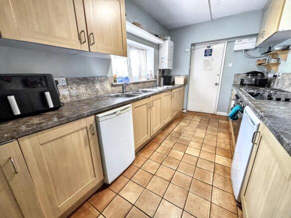 A well-maintained kitchen featuring ample count...