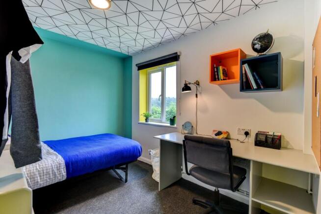 Bright and inviting double bedroom featuring a ...