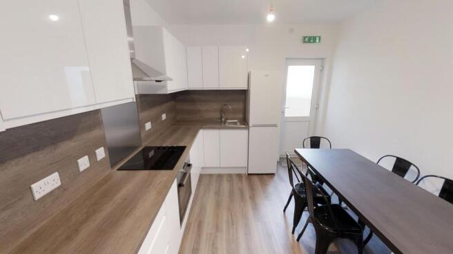 Modern kitchen featuring sleek cabinetry and am...