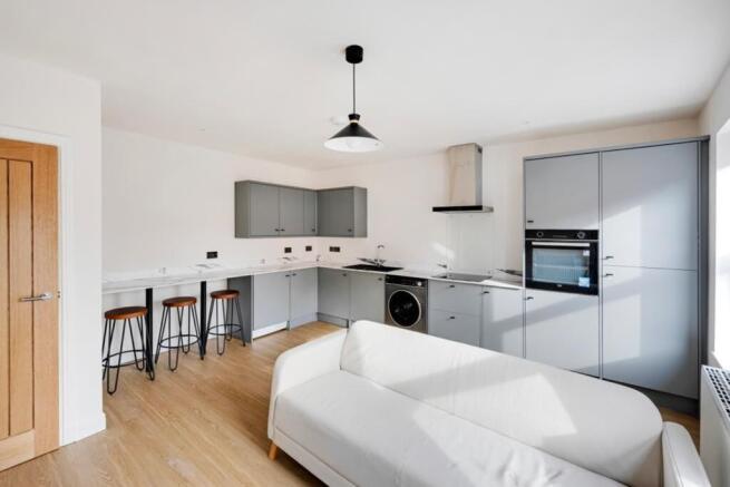 A modern kitchen with a clean design, featuring...