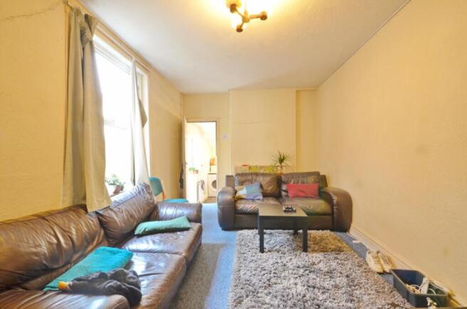 Spacious and inviting living room featuring a c...