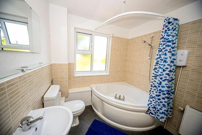 A bright and clean bathroom featuring a stylish...