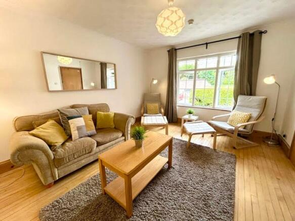 A bright and inviting large modern living room,...
