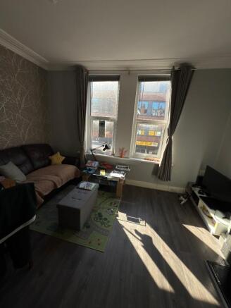 Bright and inviting living room featuring large...