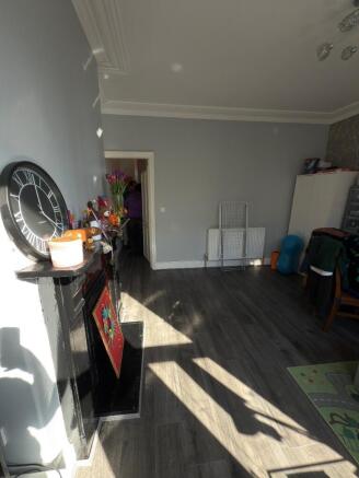 A bright and spacious living room featuring mod...