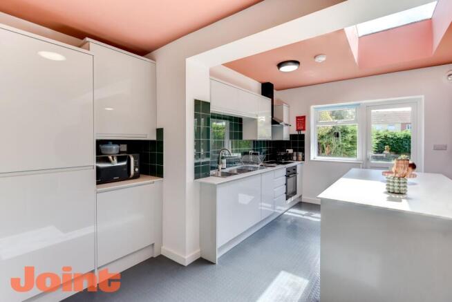 Modern kitchen featuring ample counter space, s...