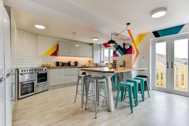 This stylish kitchen features modern appliances...