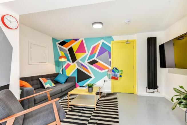 A vibrant and modern living room featuring a st...