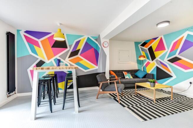 This vibrant living room features stylish decor...