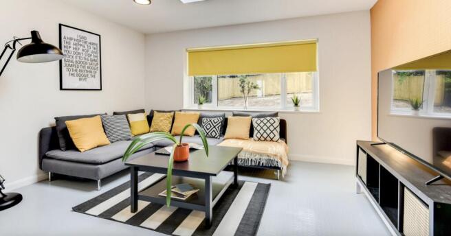 A modern and inviting living room featuring a c...