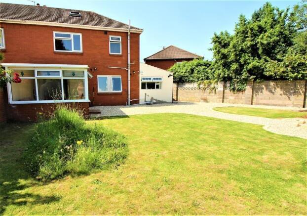 A beautifully maintained garden featuring lush ...