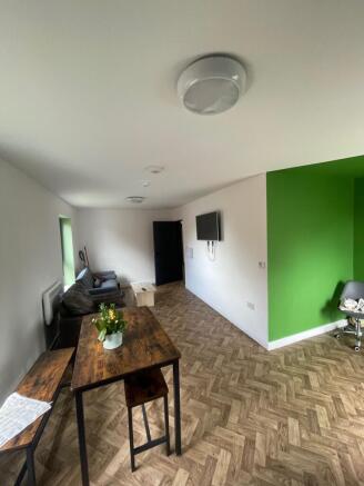 Spacious and inviting living room featuring a c...