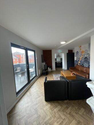 Spacious and contemporary living room featuring...