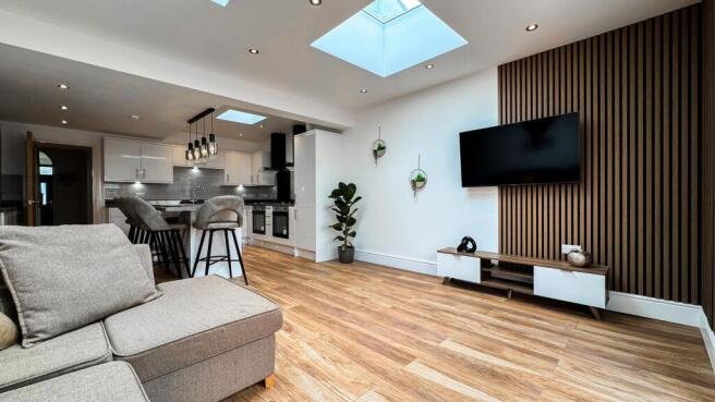 A beautifully designed living room featuring mo...