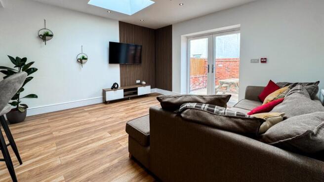 Spacious and inviting living room filled with n...
