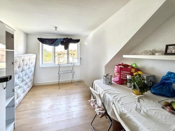 A cozy double bedroom featuring large windows t...