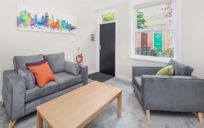 Bright and inviting living room featuring conte...