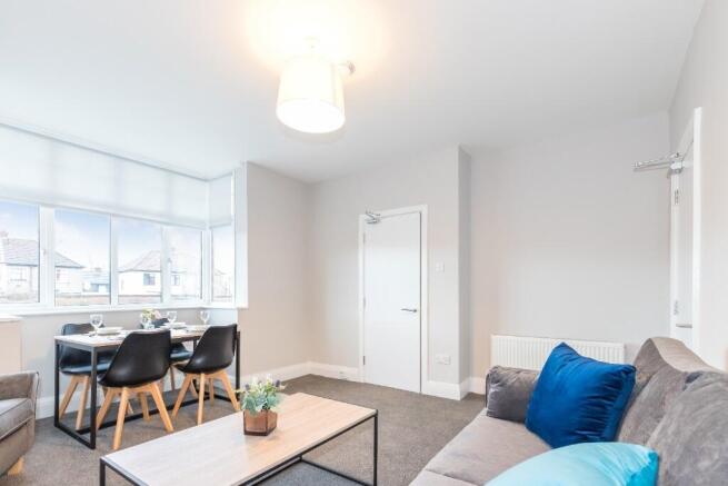 A bright and inviting living room featuring mod...