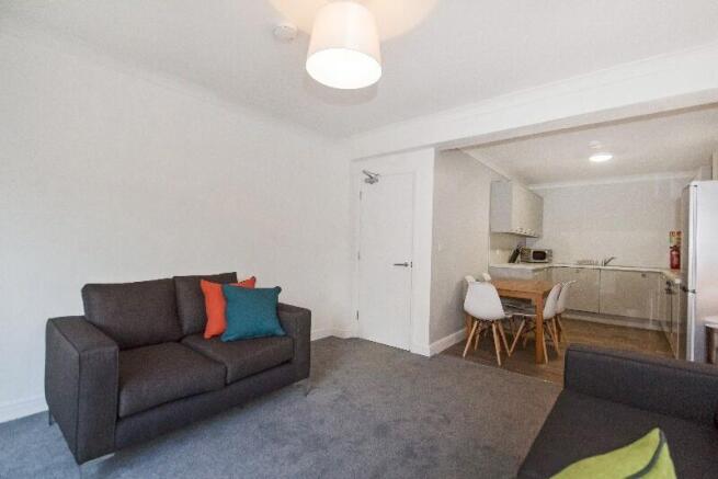 This inviting living room features a modern des...