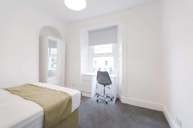 Bright and inviting double bedroom featuring a ...